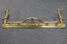 A brass Art Nouveau fire curb