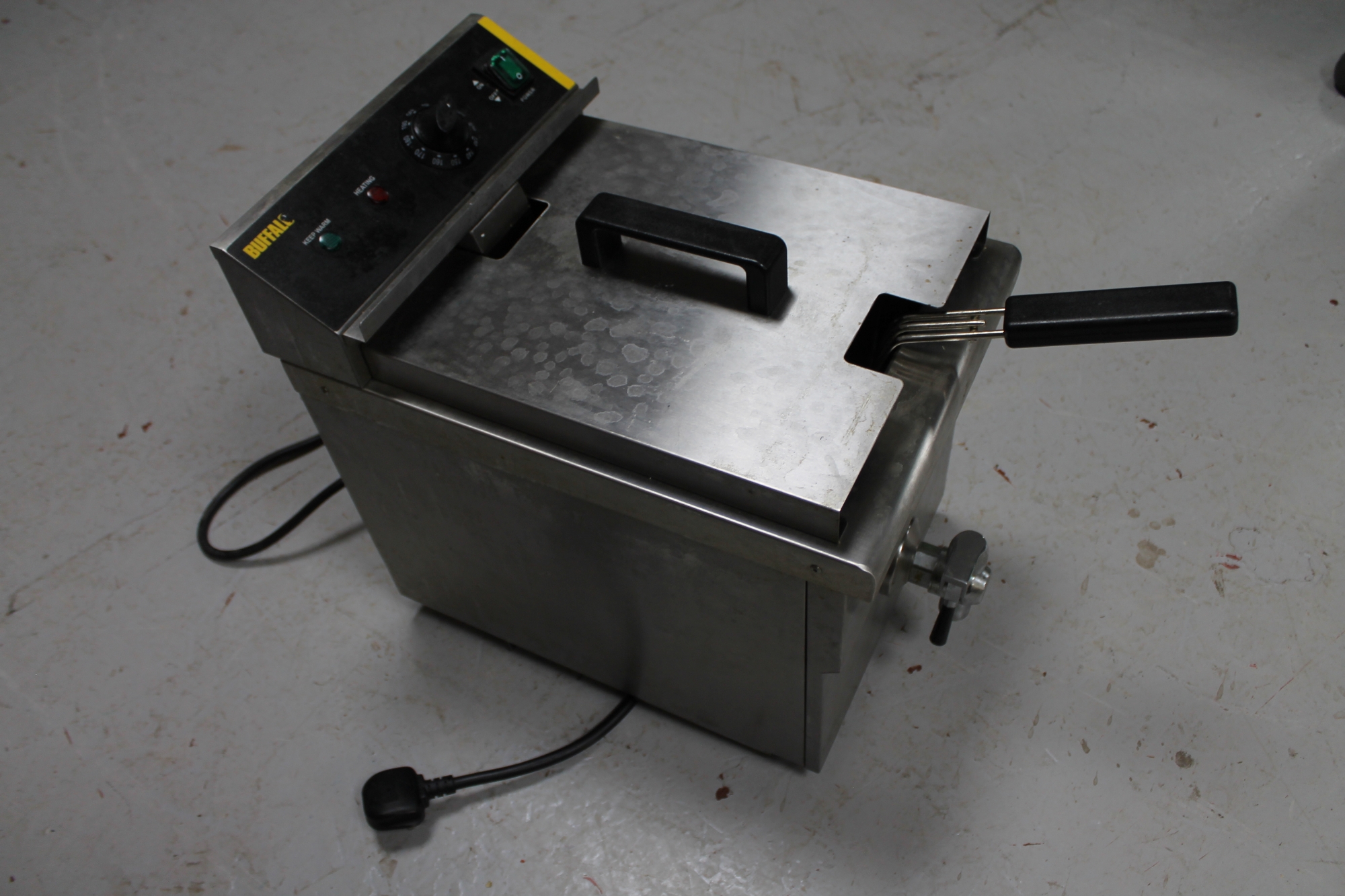 A Buffalo stainless steel single basket fryer