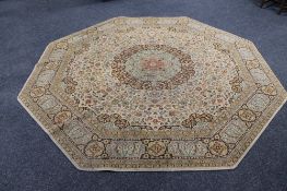 An octagonal floral rug. CONDITION REPORT: 247cm diameter. Machine made.