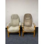 A pair of beech framed high backed armchairs.