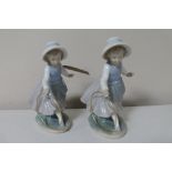 Two Nao figures of girls with hoops