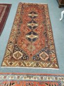 A Persian rug 130 cm x 278 cm