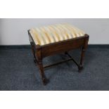 An Edwardian piano stool with music drawer.