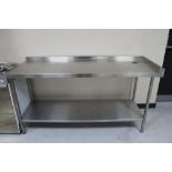 A two tier stainless steel prep table.