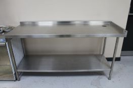 A two tier stainless steel prep table.
