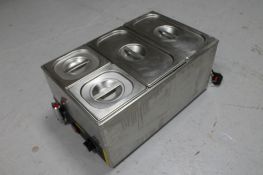 A Buffalo stainless steel bain marie with four pots and lids