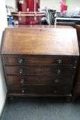 An early Victorian bureau fitted four drawers.