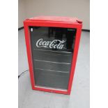 A Husky Coca Cola under bench fridge