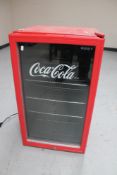 A Husky Coca Cola under bench fridge