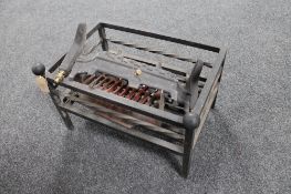 A cast iron fire basket and a fire grate
