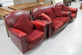 A 1930's red vinyl upholstered three piece suite