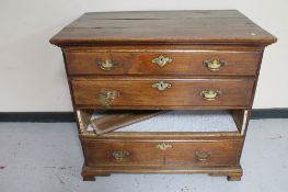 A George III provincial elm four drawer chest (a/f).