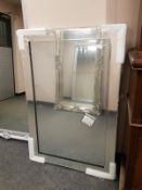 An all glass framed mirror,