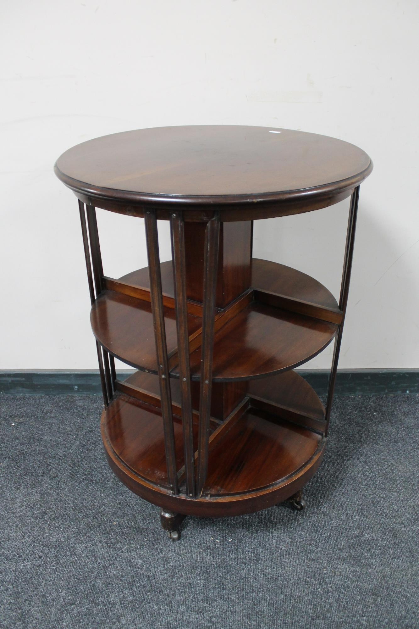 An Edwardian mahogany cylindrical revolving bookcase.