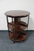 An Edwardian mahogany cylindrical revolving bookcase.