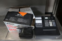 A Casio SE-G1 cash register with keys together with a printer