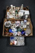 Two boxes of assorted china and glass ware to include figurines, china flower posies, mugs,