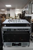 A flight case containing a Crown LPS 2500 power amplifier,