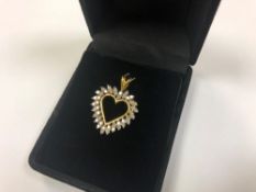 A 10ct gold diamond set heart pendant CONDITION REPORT: 3.0g.