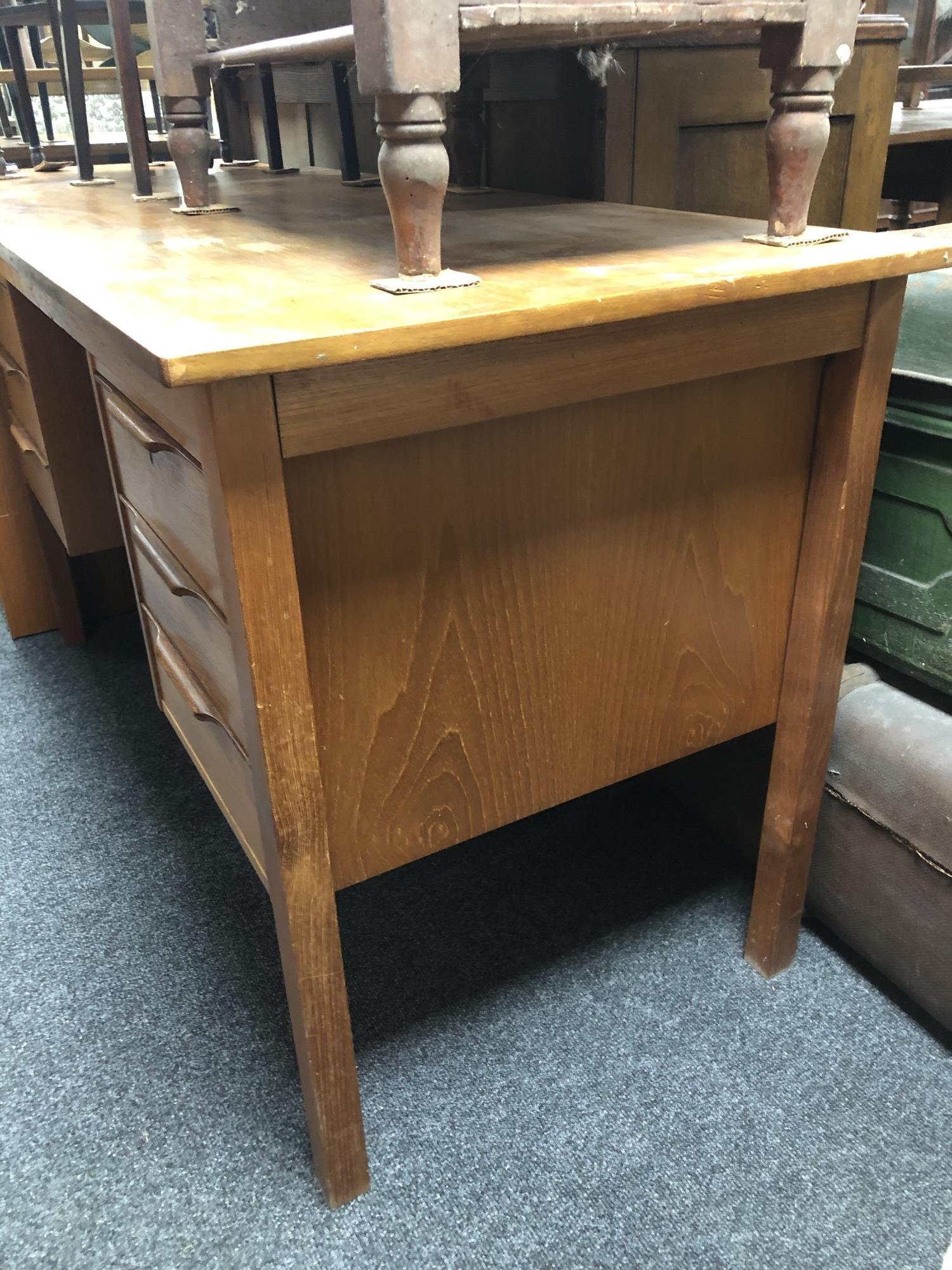 A mid 20th century teak twin pedestal writing desk and teak filing chest. - Image 6 of 8