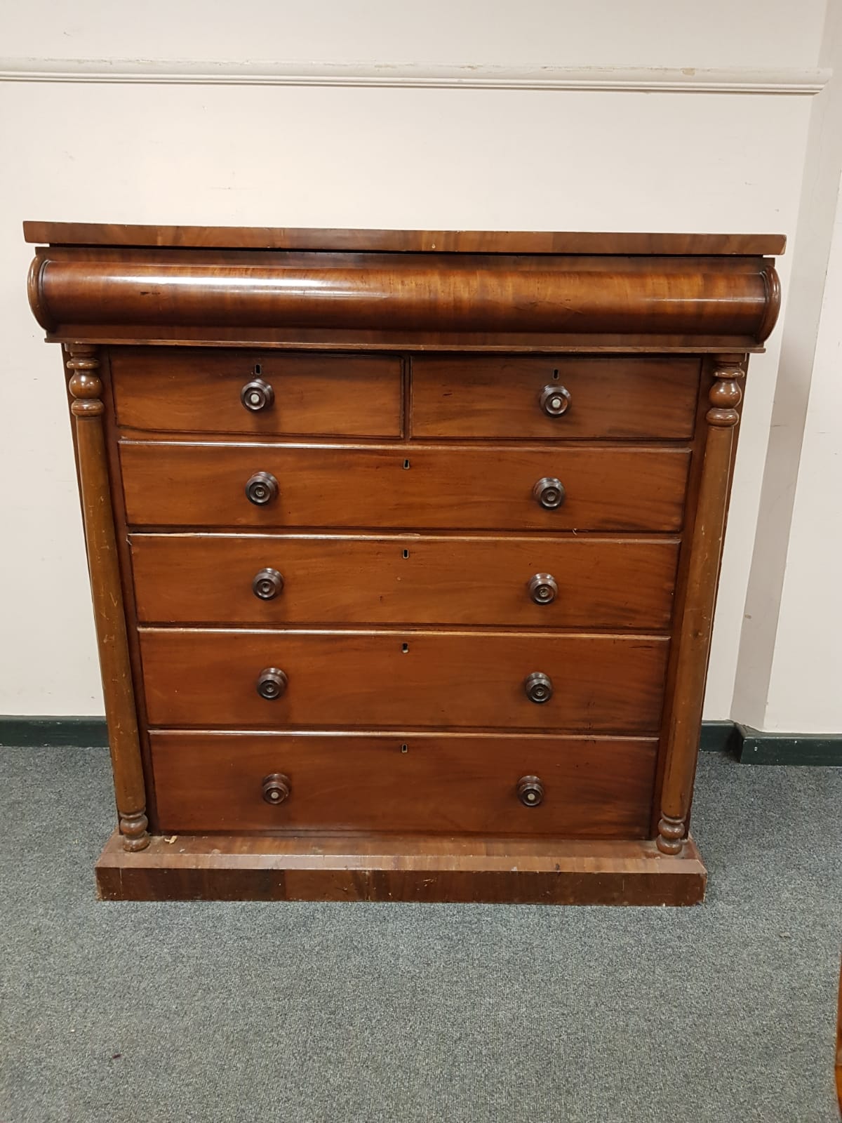 A Victorian mahogany seven drawer chest,