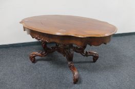 A shaped continental mahogany low table
