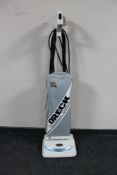 An Oreck XL2 Champagne Edition upright vacuum cleaner