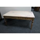 A French style marble topped coffee table on ormolu mounted base