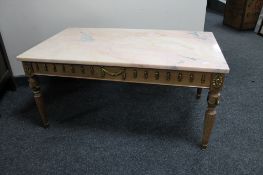 A French style marble topped coffee table on ormolu mounted base