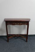 A reproduction mahogany hall table.