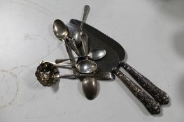 A collection of silver cutlery, caddy spoon, five teaspoons,