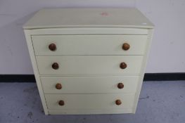 A 20th century painted four drawer chest.