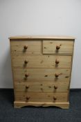 A traditional style pine six drawer chest,