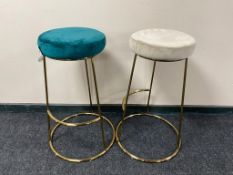 A pair of contemporary bar stools on metal legs upholstered in turquoise and grey fabric