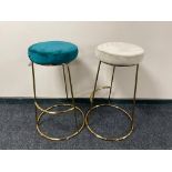 A pair of contemporary bar stools on metal legs upholstered in turquoise and grey fabric