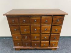 A reproduction multi drawer chest,