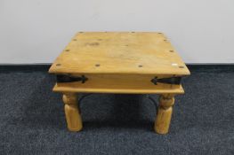 A pine lamp table with metal mounts