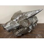 A reclaimed metal sculpture of a wolf head