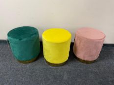 Three contemporary stools upholstered in a suede fabric,