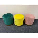 Three contemporary stools upholstered in a suede fabric,