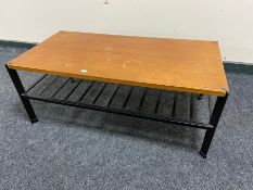 A 20th century teak topped coffee table on metal legs