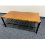 A 20th century teak topped coffee table on metal legs