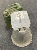 A 20l jerry can together with an industrial halogen light fitting