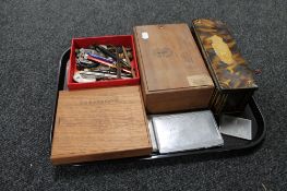 A tray of tin and cigar box of cigarette cards pens,