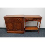 An inlaid yew wood double door cabinet fitted with two drawers together with two tier hall table