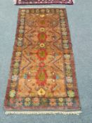 An Afghan village rug of polychrome design,