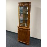 A yew wood corner display cabinet