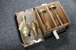 A tray of pine box with Chinese lettering containing two brass candlesticks,