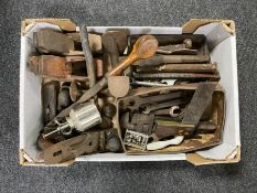 A box of vintage hand tools, spanners, metal chisels, cobbler's last, oil can,