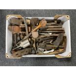 A box of vintage hand tools, spanners, metal chisels, cobbler's last, oil can,